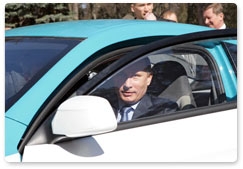 Prime Minister Vladimir Putin test-drives the new Russian Yo-Mobile