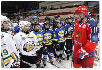 Prime Minister Vladimir Putin takes part in ice-hockey practice with young players at Luzhniki before Golden Puck Youth Hockey Finals