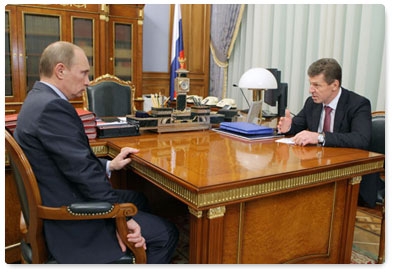 Prime Minister Vladimir Putin and Deputy Prime Minister Dmitry Kozak discuss preparations for the Sochi 2014 Olympics