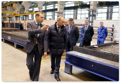 Prime Minister Vladimir Putin visits the ZhBI-6 concrete plant where he checks out its production cycle and compares old and new equipment