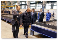 Prime Minister Vladimir Putin visits the ZhBI-6 concrete plant where he checks out its production cycle and compares old and new equipment