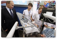 Prime Minister Vladimir Putin visits exhibition of mini healthcare clinics