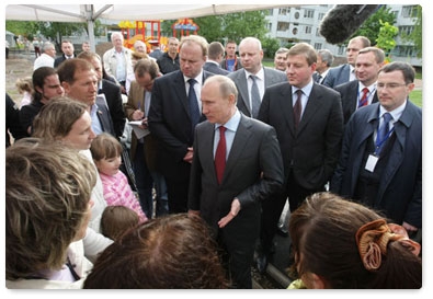 During a working visit to Pskov, Prime Minister Vladimir Putin inspects the city’s courtyards and talks to residents