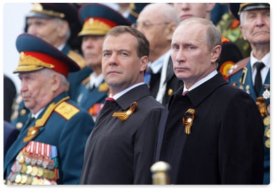 Prime Minister Vladimir Putin attends a military parade on Red Square marking the 66th anniversary of Victory in the Great Patriotic War