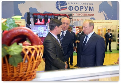 Prime Minister Vladimir Putin visits an exhibition of local farming and food processing products in the village of Atemar during his trip to Mordovia