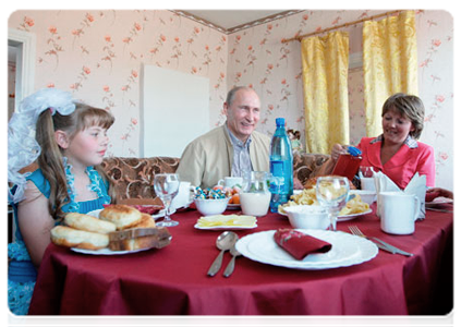 Prime Minister Vladimir Putin visited the village of Tugnui to meet with Dasha, the girl he presented a Cinderella dress to two years ago|1 july, 2011|13:08