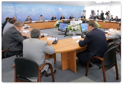Prime Minister Vladimir Putin chairs a meeting on low-rise housing construction at Stupino near Moscow
