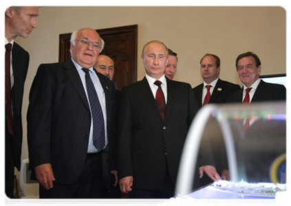 Prime Minister Vladimir Putin examines blueprints for the Orlovsky Tunnel under the Neva River while on a working trip to St Petersburg|7 july, 2011|22:37