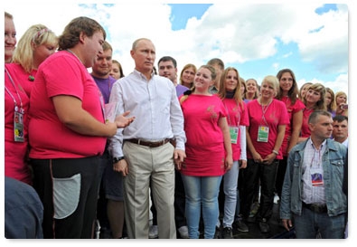 Prime Minister Vladimir Putin visits booths and speaks with participants at the Seliger-2011 International Youth Forum