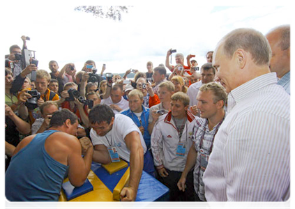 Prime Minister Vladimir Putin visits booths and speaks with participants at the Seliger-2011 International Youth Forum|1 august, 2011|18:35