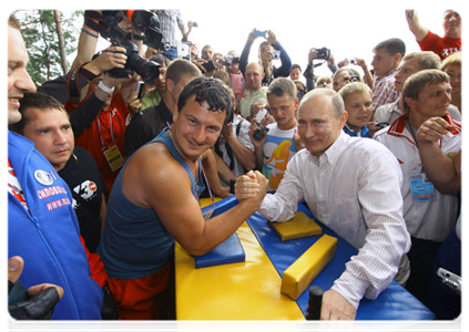 Prime Minister Vladimir Putin visits booths and speaks with participants at the Seliger-2011 International Youth Forum|1 august, 2011|18:35