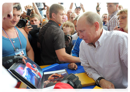 Prime Minister Vladimir Putin visits booths and speaks with participants at the Seliger-2011 International Youth Forum|1 august, 2011|19:10