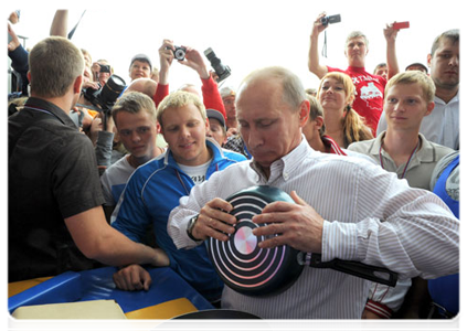 Prime Minister Vladimir Putin visits booths and speaks with participants at the Seliger-2011 International Youth Forum|1 august, 2011|19:10