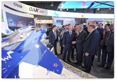 Prime Minister Vladimir Putin tours the MAKS 2011 international air show, showcasing the latest in aerospace technology from Russian and foreign companies