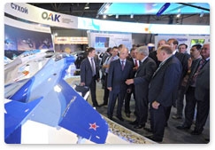 Prime Minister Vladimir Putin tours the MAKS 2011 international air show, showcasing the latest in aerospace technology from Russian and foreign companies