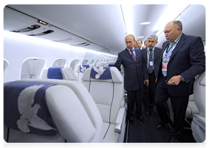 Prime Minister Vladimir Putin examines an MS-21 at the Unified Aircraft Corporation pavilion. The medium-range MS-21 jet is meant to replace the TU-154|17 august, 2011|20:54