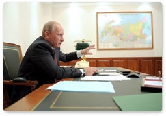 Prime Minister Vladimir Putin holds a videoconference on road building