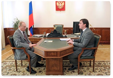 Prime Minister Vladimir Putin meets with Russian Agricultural Bank CEO Dmitry Patrushev