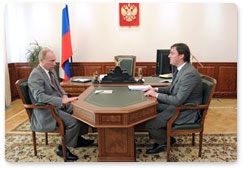 Prime Minister Vladimir Putin meets with Russian Agricultural Bank CEO Dmitry Patrushev