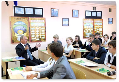 During a visit to a secondary school in Podolsk, Prime Minister Vladimir Putin drops in on an 11th-year social studies class