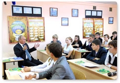 During a visit to a secondary school in Podolsk, Prime Minister Vladimir Putin drops in on an 11th-year social studies class