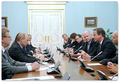 Prime Minister Vladimir Putin meets with British Prime Minister David Cameron