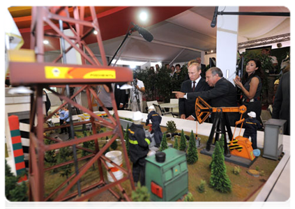 Prime Minister Vladimir Putin visiting innovation project displays from various regions at the X International Investment Forum Sochi-2011|16 september, 2011|15:48