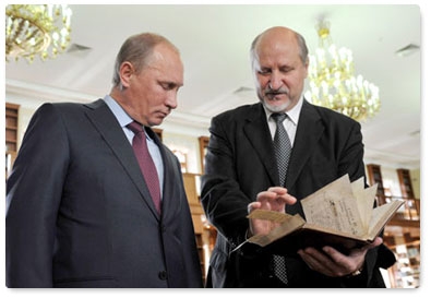 Prime Minister Vladimir Putin visits the Russian State Library in Pashkov House before speaking at a conference of the Russian Book Union