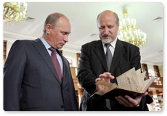 Prime Minister Vladimir Putin visits the Russian State Library in Pashkov House before speaking at a conference of the Russian Book Union