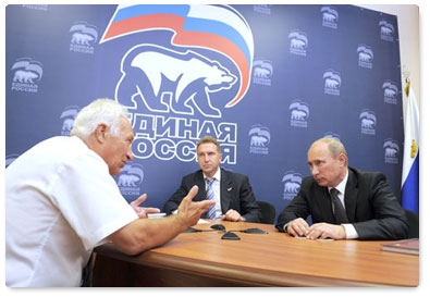 Prime Minister Vladimir Putin receives people at the public reception room of the United Russia chairman in Vladivostok. The reception was attended by First Deputy Prime Minister Igor Shuvalov