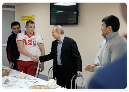 Prime Minister Vladimir Putin speaks with members of the national judo team during a visit to the Regional Judo Centre in Kemerovo|24 january, 2012|18:12