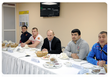 Prime Minister Vladimir Putin speaks with members of the national judo team during a visit to the Regional Judo Centre in Kemerovo|24 january, 2012|18:15