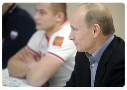 Prime Minister Vladimir Putin speaks with members of the national judo team during a visit to the Regional Judo Centre in Kemerovo|24 january, 2012|18:20