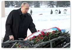 Prime Minister Vladimir Putin visits the Piskaryovskoye memorial cemetery and lays a wreath at the Motherland bronze sculpture during his working visit to St Petersburg