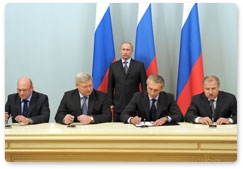 Prime Minister Vladimir Putin attends the signing ceremony for the partnership agreement to develop Tom Football Club