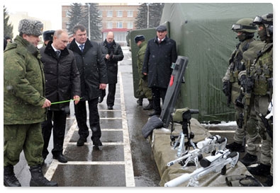 Prime Minister Vladimir Putin lays flowers at fallen heroes memorial during visit to 5th Guards Tamanskaya Separate Motorised Brigade