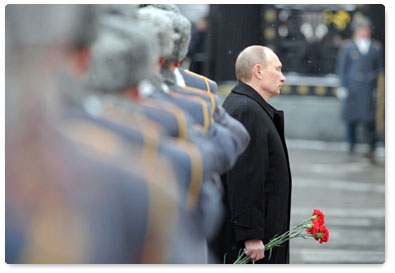 Prime Minister Vladimir Putin attends a wreath-laying ceremony on Defender of the Fatherland Day at the Tomb of the Unknown Soldier in Moscow