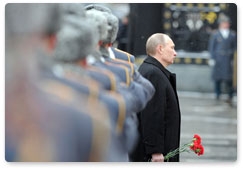 Prime Minister Vladimir Putin attends a wreath-laying ceremony on Defender of the Fatherland Day at the Tomb of the Unknown Soldier in Moscow