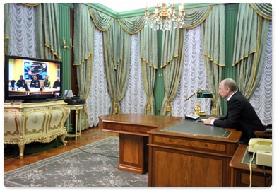 Prime Minister Vladimir Putin conducts a videoconference on tackling the collapse of an entrance to an apartment block in Astrakhan