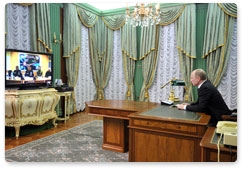 Prime Minister Vladimir Putin conducts a videoconference on tackling the collapse of an entrance to an apartment block in Astrakhan