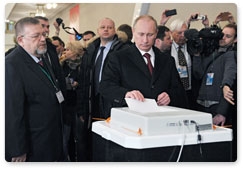 В.В.Путин вместе с супругой Л.А.Путиной проголосовал на выборах Президента Российской Федерации