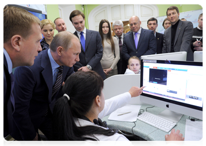 Vladimir Putin reviews the system for the webcam monitoring of polling stations during his visit to the 2012 election monitoring centre|6 march, 2012|15:24