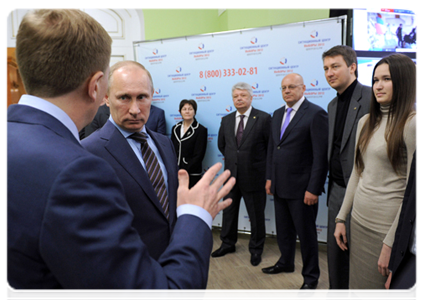 Vladimir Putin reviews the system for the webcam monitoring of polling stations during his visit to the 2012 election monitoring centre|6 march, 2012|15:26