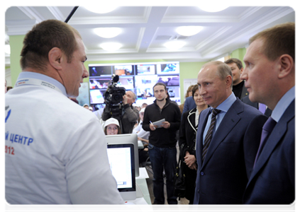 Vladimir Putin reviews the system for the webcam monitoring of polling stations during his visit to the 2012 election monitoring centre|6 march, 2012|15:28