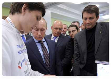 Vladimir Putin reviews the system for the webcam monitoring of polling stations during his visit to the 2012 election monitoring centre|6 march, 2012|15:29