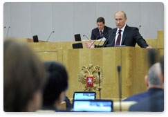 Prime Minister Vladimir Putin delivers his report on the government’s performance in 2011 to the State Duma