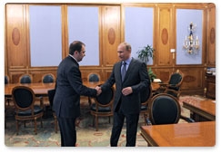 Prime Minister Vladimir Putin conducts a working meeting with Pension Fund Chairman Anton Drozdov